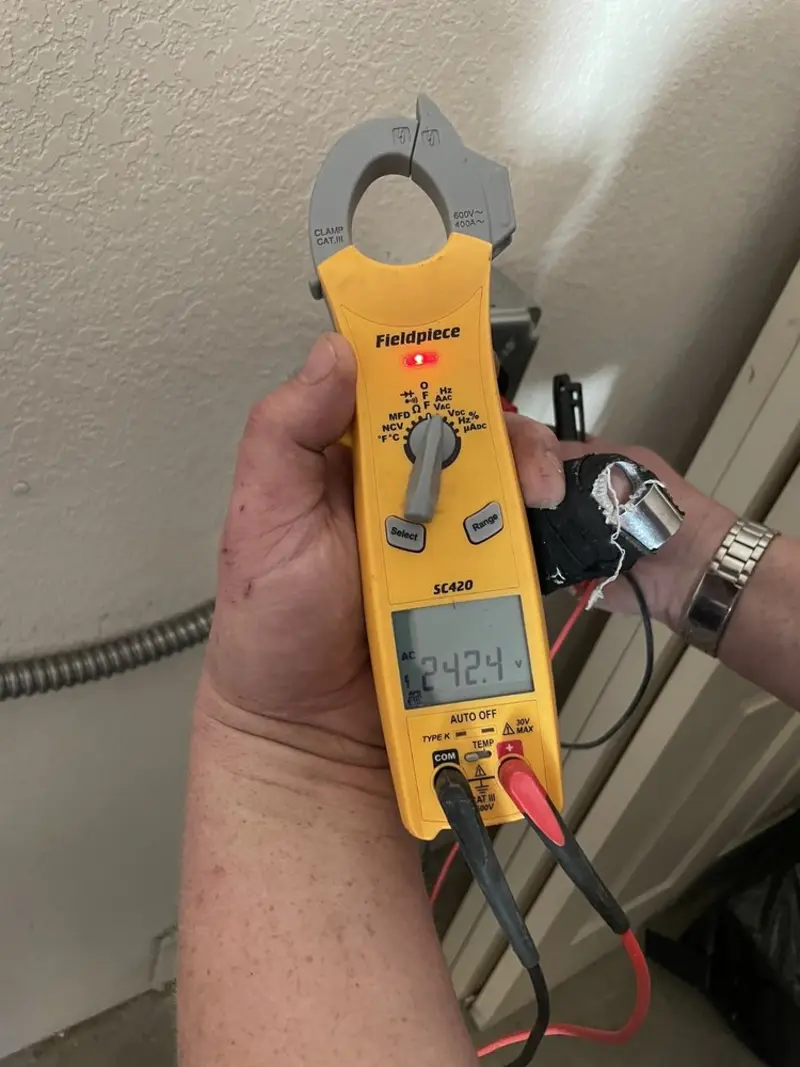 Voltage testing with clamp meter during Ceiling Fan Installation in Farmington